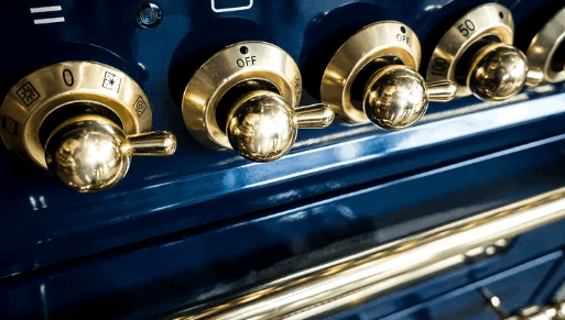 Golden Knobs and Handle on Ovens 