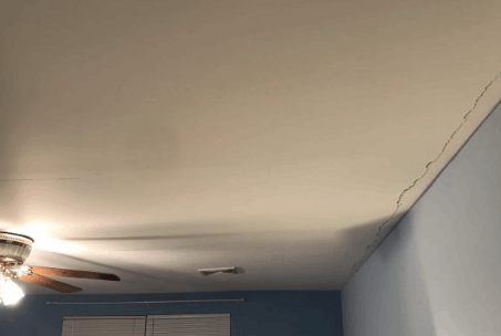 Sagging ceiling problem in bad drywall job.